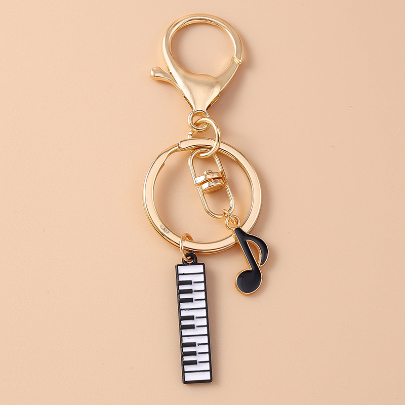 Cute Enamel Mini Piano Keychai - Musical Instrument Tabla recension och pris