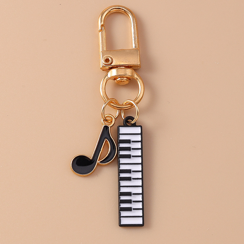 Cute Enamel Mini Piano Keychai - Musical Instrument Tabla recension och pris